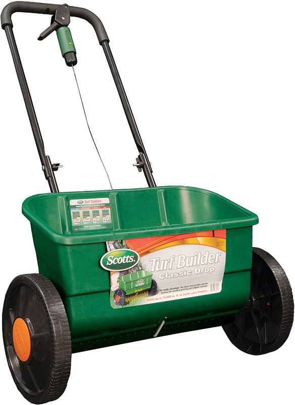 Photo 1 of ***USED*** Scotts Turf Builder Classic Drop Spreader, Great for Applying Grass Seed and Fertilizer, Holds up to 10,000 sq. ft of Product
