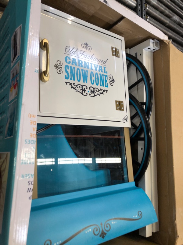 Photo 2 of Nostalgia Snow Cone Cart, 48-Inch, Makes 48 ICY Treats, Vintage Snow Machine Includes Metal Scoop, Storage Compartment, Wheels for Easy Mobility, White/Blue