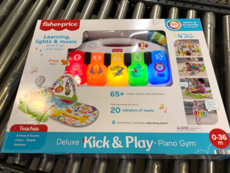 Photo 2 of Fisher-Price Deluxe Kick & Play Piano Gym