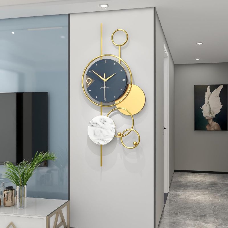 Photo 1 of YIJIDECOR Large Wall Clocks for Living Room Decor Big Modern Wall Clock Battery Operated Silent Non-Ticking for Bedroom Office Kitchen Home Decoration Gold Metal Unique Wall Watch Clock 15 x 30 inches Casual