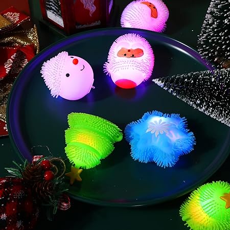 Photo 1 of 24 Pack Christmas Stress Toys Gifts for Boys Girls Light up LED Fidget Christmas Tree Snowflake Snowman Santa Claus Fidget Stress Xmas Party Favors Bags Filler