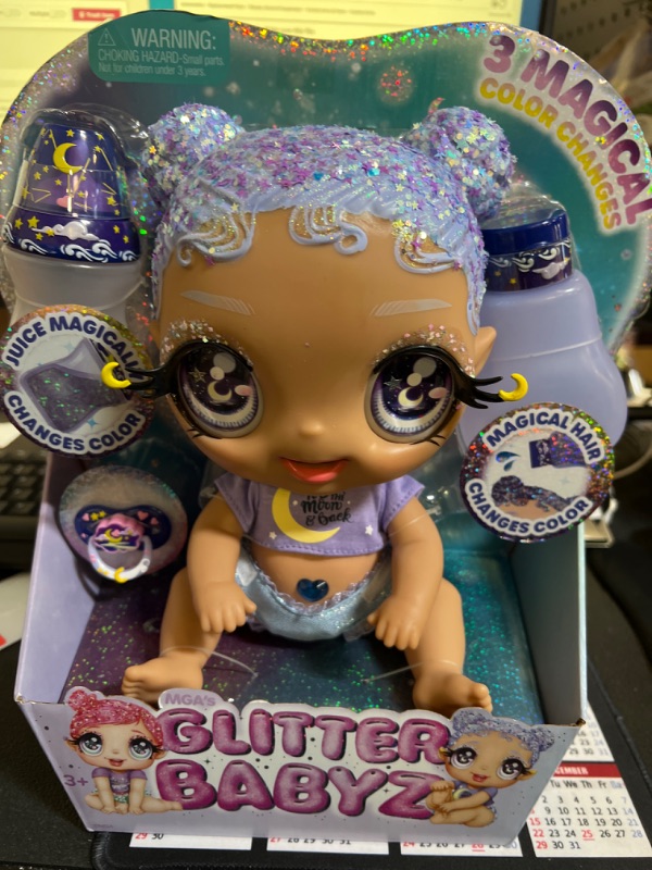 Photo 2 of MGA Entertainment Glitter Babyz Selena Stargazer Baby Doll 3 Magical Color Changes, Pastel Purple Glitter Hair, Moon & Stars Outfit, Diaper, Bottle, Pacifier Accessories Gift for Kids, Ages 3 4 5+