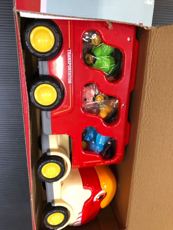 Photo 1 of Dinosaur Car Toys for Toddlers and Kids, Friction Cute Tyrannosaurus Transport Truck with 5 Cartoon Pull Back Dino Cars, 5 in 1 Dino Carrier Play Set for 2 3 4 5 6+ Year Old Boys & Girls 6 in 1 dino play set