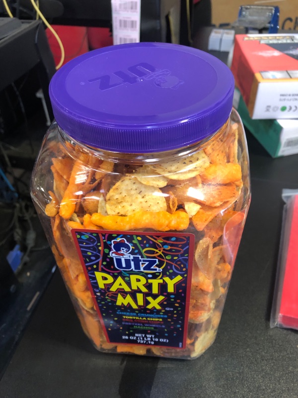 Photo 2 of  expires- april/22/24
Utz Party Mix - 26 Ounce Barrel - Tasty Snack Mix Includes Corn Tortillas, Nacho Tortillas, Pretzels, BBQ Corn Chips and Cheese Curls, Easy and Quick Party Snacks, Cholesterol Free and Trans-Fat Free