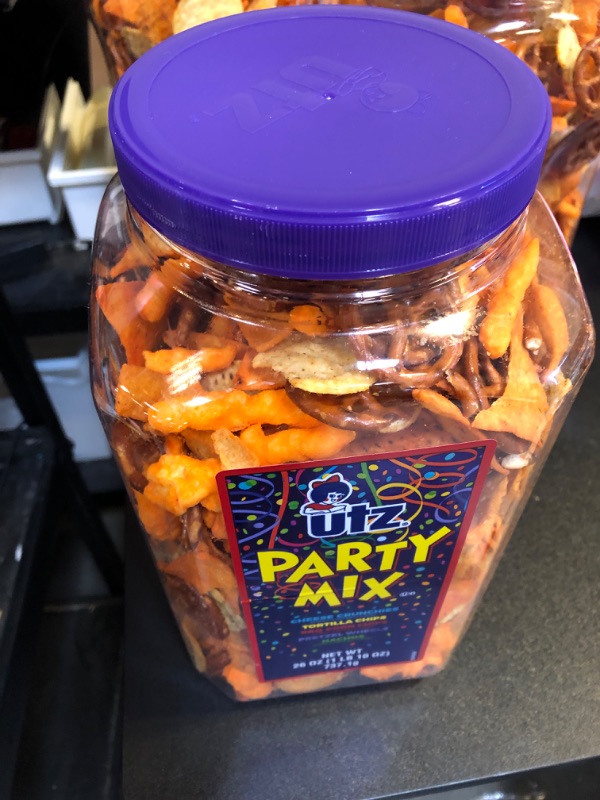 Photo 2 of  expires- april/22/24
Utz Party Mix - 26 Ounce Barrel - Tasty Snack Mix Includes Corn Tortillas, Nacho Tortillas, Pretzels, BBQ Corn Chips and Cheese Curls, Easy and Quick Party Snacks, Cholesterol Free and Trans-Fat Free