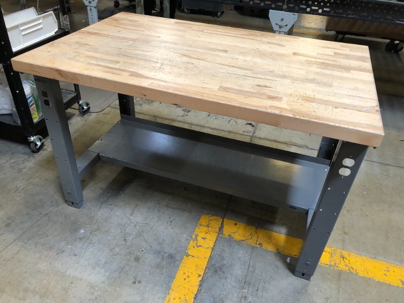 Photo 2 of ULINE Adjustable Height Maple Packing table 48"x30"