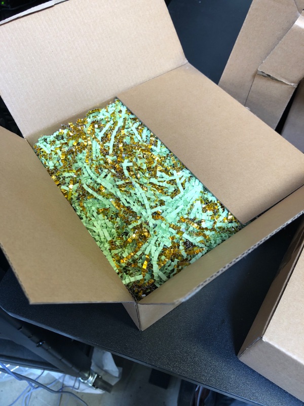 Photo 1 of crinkle cut paper shred filler green and gold