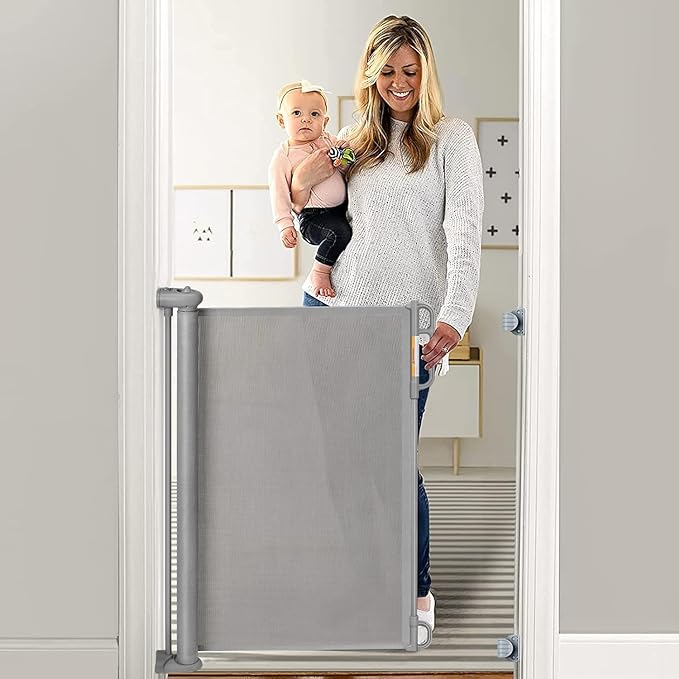 Photo 1 of Momcozy Retractable Baby Gate, 33" Tall, Extends up to 55" Wide, Child Safety Baby Gates for Stairs, Doorways, Hallways, Indoor, Outdoor33" Tall x 55" Wide 