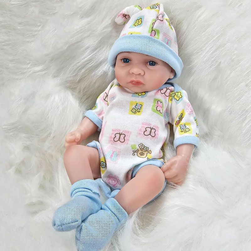 Photo 1 of Reborn Baby Boy Dolls, 10 inch Anatomically Correct Realistic Silicone Vinyl Baby Doll, Soft Body Lifelike Newborn Baby Doll Gift Set for Kids Age 3+
