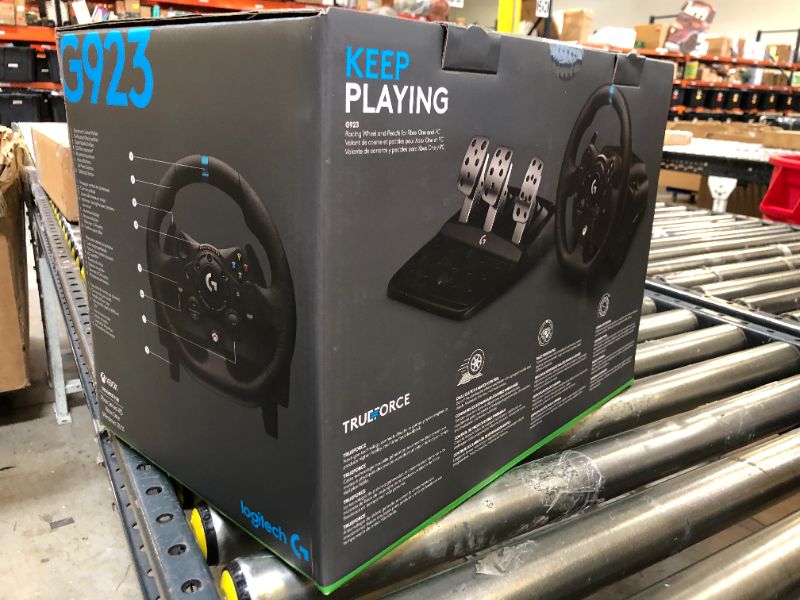 Photo 1 of Logitech G923 Racing Wheel and Pedals for Xbox X|S, Xbox One and PC featuring TRUEFORCE up to 1000 Hz Force Feedback, Responsive Pedal, Dual Clutch Launch Control, and Genuine Leather Wheel Cover Xbox|PC Wheel Only