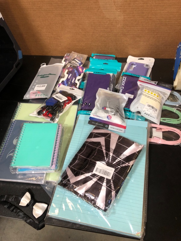 Photo 1 of BAG LOT - Cellphone cases, airpod cases, notebooks and other misc items.