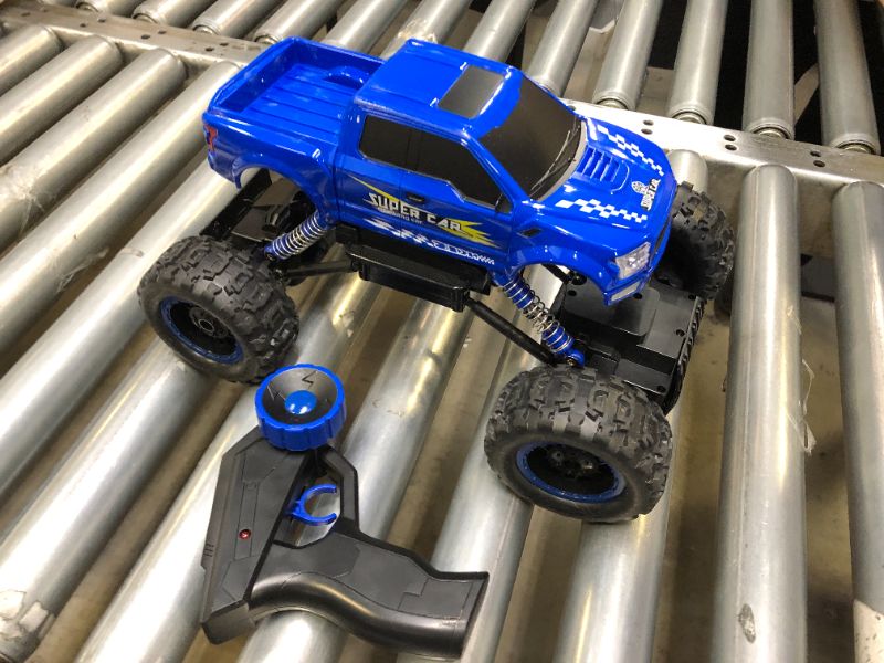 Photo 2 of DOUBLE E 1:12 Remote Control Monster Truck Rc Car for Boys Gifts,2.4Ghz All Terrain Hobby RC Cars,4WD Dual Motors LED Headlight Rock Crawler RC Monster Truck Blue