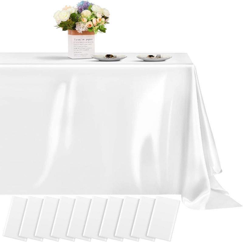 Photo 1 of white satin table bulk covers  