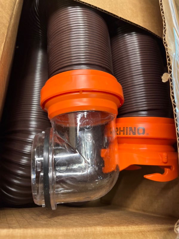 Photo 2 of Camco RhinoFLEX RV Sewer Hose Kit with Swivel Transparent Elbow and 4-in-1 Dump Station Fitting, Brown, 15 Feet (39770) 15ft Sewer Hose Kit Frustration-Free Packaging