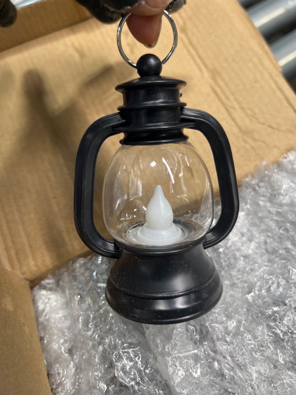 Photo 4 of 12 Pcs Mini Lantern Decorative with LED Candle 4 Inch Small Hanging Lantern Ornaments Camping Table Centerpiece Vintage Lantern Ornament Bulk for Western Cowboy Xmas (Black)