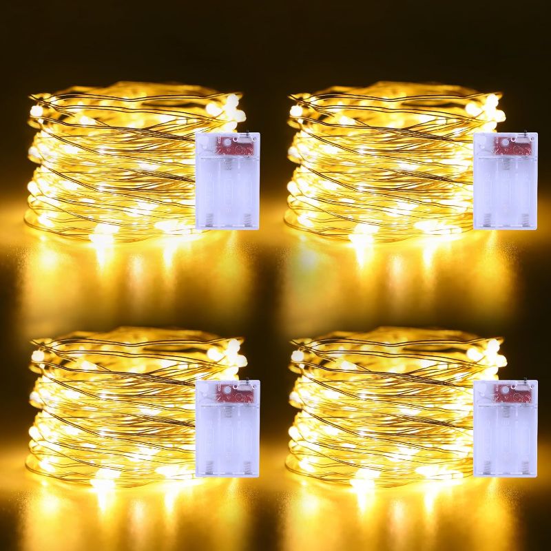 Photo 1 of Fairy Lights Battery Operated 4 Pack 50 LEDs Silver Copper Wire Twinkle Lights for Halloween Christmas Bedroom Indoor Outdoor Wedding Dorm Parties Holiday Yard Decorations (Warm White)
