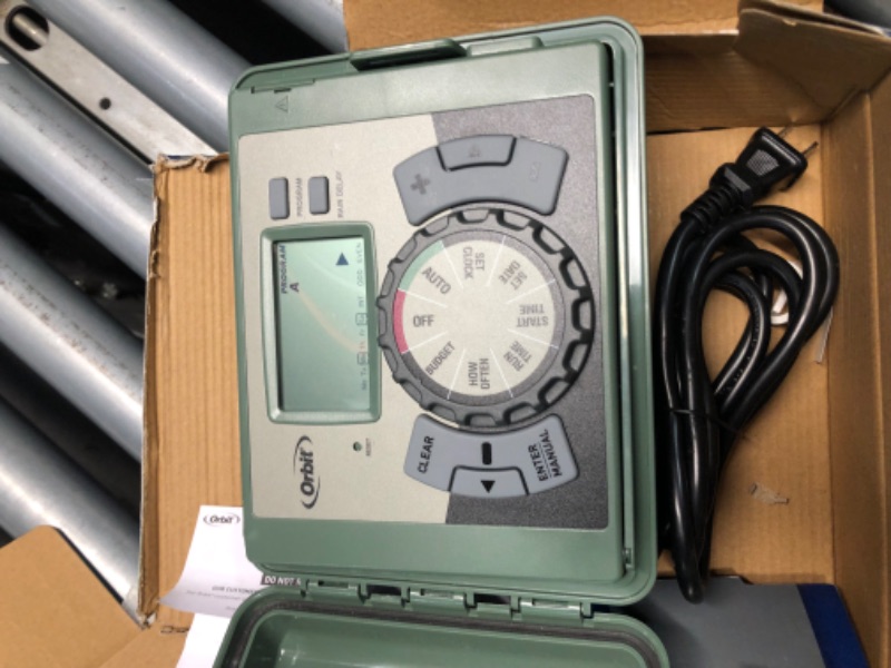 Photo 4 of **KEY NOT INCLUDED**
Orbit 57894 4-Station Outdoor Swing Panel Sprinkler System Timer 4-Station Green