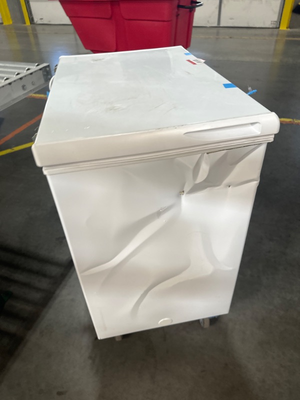 Photo 7 of **DAMAGE / PARTS ONLY** 6.9 cu. ft. Manual Defrost Chest Freezer with LED Light Type in White Garage Ready *Lid damaged, side dented in, back hinges damaged*
