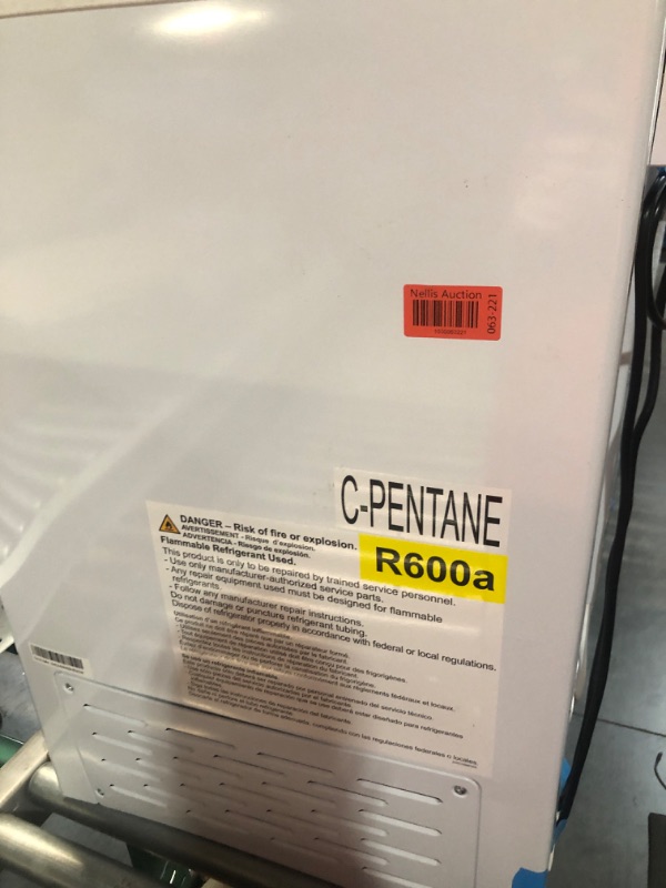 Photo 6 of **DAMAGE / PARTS ONLY** 6.9 cu. ft. Manual Defrost Chest Freezer with LED Light Type in White Garage Ready *Lid damaged, side dented in, back hinges damaged*
