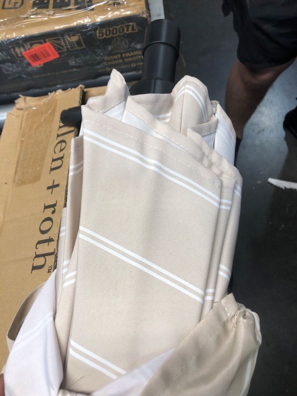 Photo 1 of ***USED - LIKELY MISSING PARTS - UNABLE TO VERIFY FUNCTIONALITY***
allen + roth 9-ft Aluminum Tan Striped Auto-tilt Market Patio Umbrella