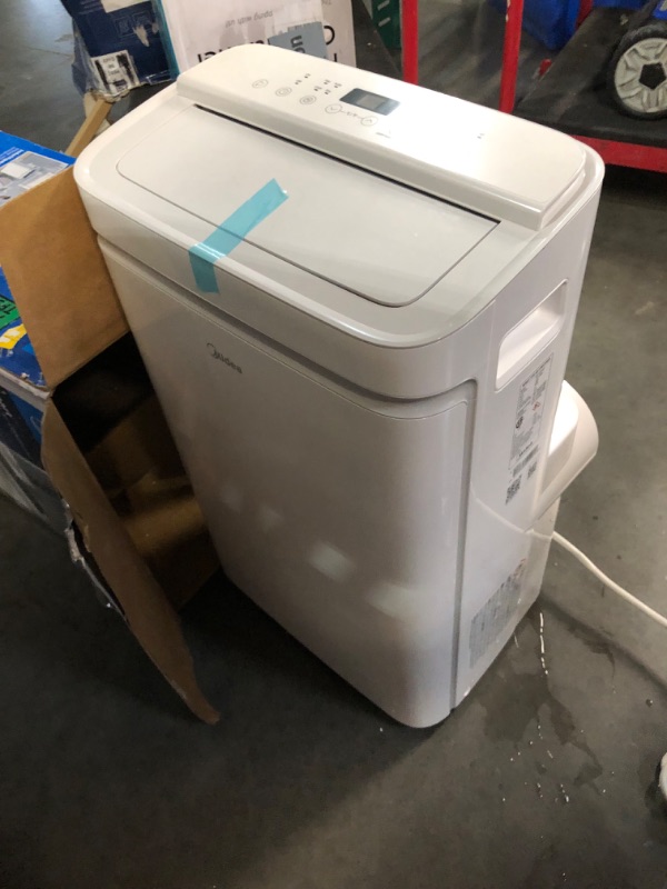 Photo 9 of ***HEAVILY USED AND DIRTY - POWERS ON - UNABLE TO TEST FURTHER - LIKELY MISSING PARTS - SEE PICTURES***
Midea 14,000 BTU ASHRAE (10,000 BTU SACC) Portable Air Conditioner, Cools up to 375 Sq. Ft., with Dehumidifier & Fan 