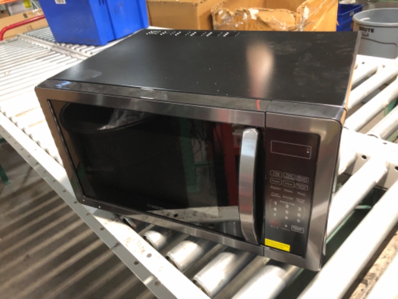 Photo 10 of ***USED - DAMAGED - UNTESTED - SEE COMMENTS***
Farberware Countertop Microwave 1000 Watts, 1.1 cu ft - Microwave Oven With LED Lighting and Child Lock - Perfect for Apartments and Dorms - Easy Clean Black Stainless Steel