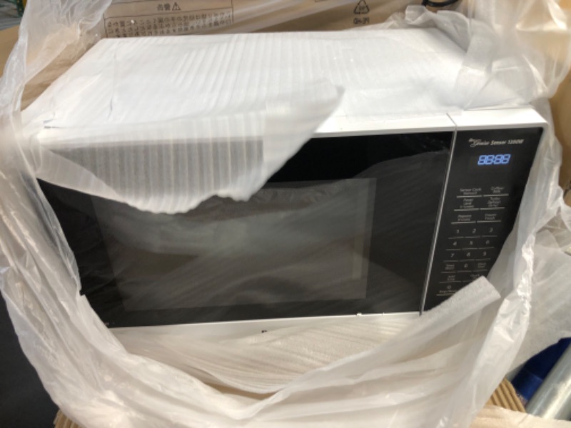 Photo 2 of (for parts/ dented) 1.2 Cu. Ft. 1200 Watt SN65KW Microwave with Inverter and Genius Sensor