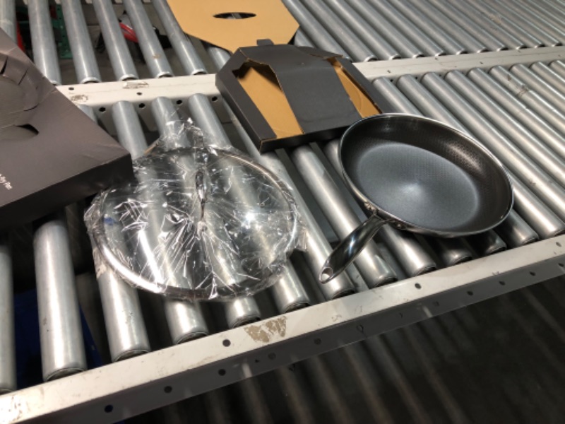 Photo 3 of ***USED - LIKELY MISSING PARTS - UNABLE TO VERIFY FUNCTIONALITY***
Hexclad  Nonstick 6-Piece Fry Pan Set, 8, 10 and 12-Inch Frying Pans with Tempered Glass Lids, Stay-Cool Handles, Dishwasher and Oven Safe, Induction Ready, Compatible with All Cooktops 6-