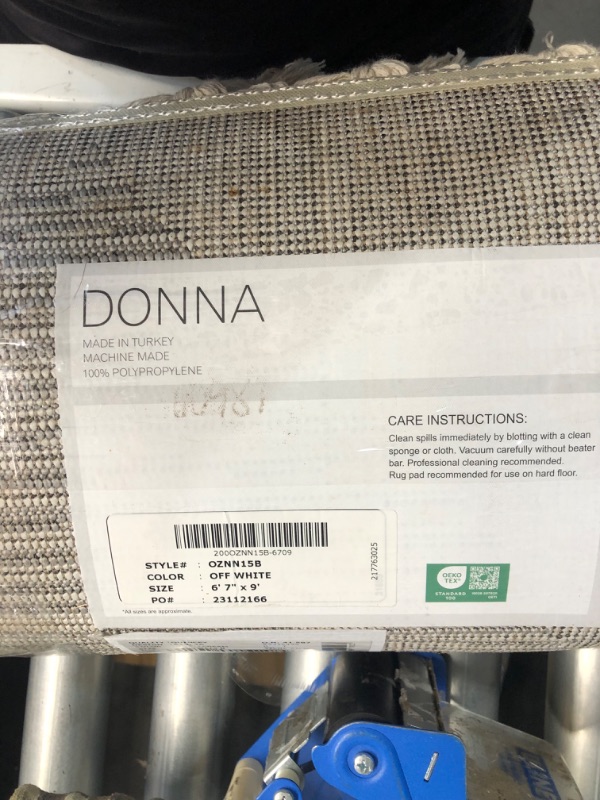 Photo 2 of **ITEM HAS MINOR STAINS**
DONNA Off White Rug 6' 7" x 9'