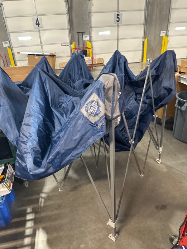 Photo 4 of **ITEM IS BLUE, STOCK PHOTO FOR REFERENCE ONLY** E-Z UP Ambassador Instant Pop Up Canopy Tent, 10' x 10', Roller Bag and 4 Piece Spike Set, BLUE