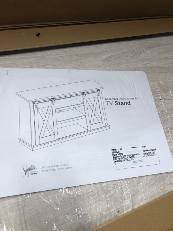 Photo 2 of ***NONREFUNDABLE - THIS SALE FINAL -  PARTS ONLY - SEE COMMENTS***
Signature Design by Ashley Dorrinson Farmhouse TV Stand Fits TVs up to 50" with Sliding Barn Doors and Storage Shelves, Whitewash & Gray