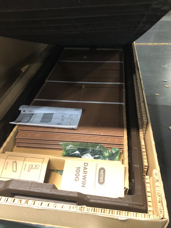 Photo 3 of ***USED - DAMAGED - LIKELY MISSING PARTS - UNABLE TO VERIFY FUNCTIONALITY***
Keter Darwin 100 Gallon Resin Large Deck Box - Organization and Storage for Patio Furniture, Outdoor Cushions, Garden Tools and Pool Toys, Brown & Black