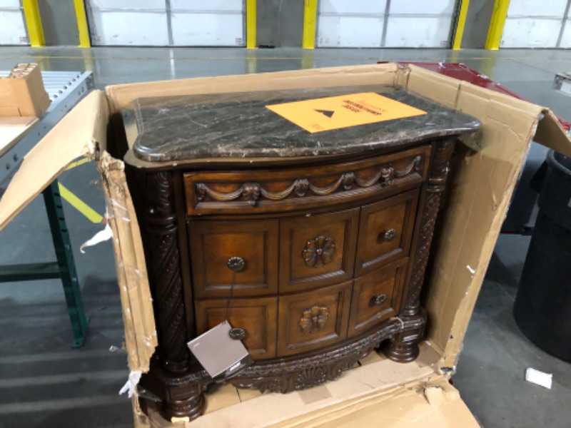 Photo 2 of ***USED - MAJOR DAMAGE - SEE COMMENTS***
Signature Design by Ashley North Shore Ornate 3 Drawer Nightstand with Marble Inlay Top, Dark Brown