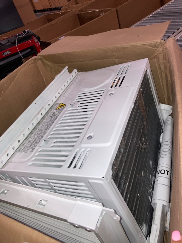 Photo 5 of ****USED***FOR PARTS ONLY**SOLD AS IS***NO RETURNS***ALL SALES ARE FINAL***FAN BLADES ARE TOUCHING THE CONDENSER**** Amazon Basics Window-Mounted Air Conditioner with Mechanical Control - Cools 150 Square Feet, 5000 BTU, AC Unit, White
 