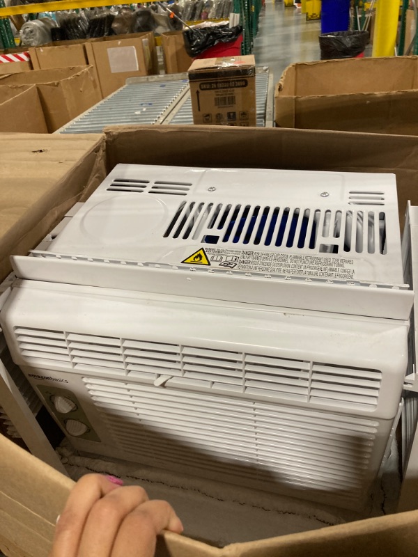 Photo 2 of ****USED***FOR PARTS ONLY**SOLD AS IS***NO RETURNS***ALL SALES ARE FINAL***FAN BLADES ARE TOUCHING THE CONDENSER**** Amazon Basics Window-Mounted Air Conditioner with Mechanical Control - Cools 150 Square Feet, 5000 BTU, AC Unit, White
 