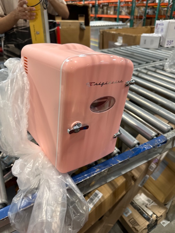 Photo 1 of ***FOR PARTS ONLY NO RETURNS***Frigidaire EFMIS175 Retro 9-Can Mini Personal Fridge Portable Cooler for Car, Office, Bedroom, Dorm Room, or Cabin, 11.8"D x 7.1"W x 10.1"H, Pink
