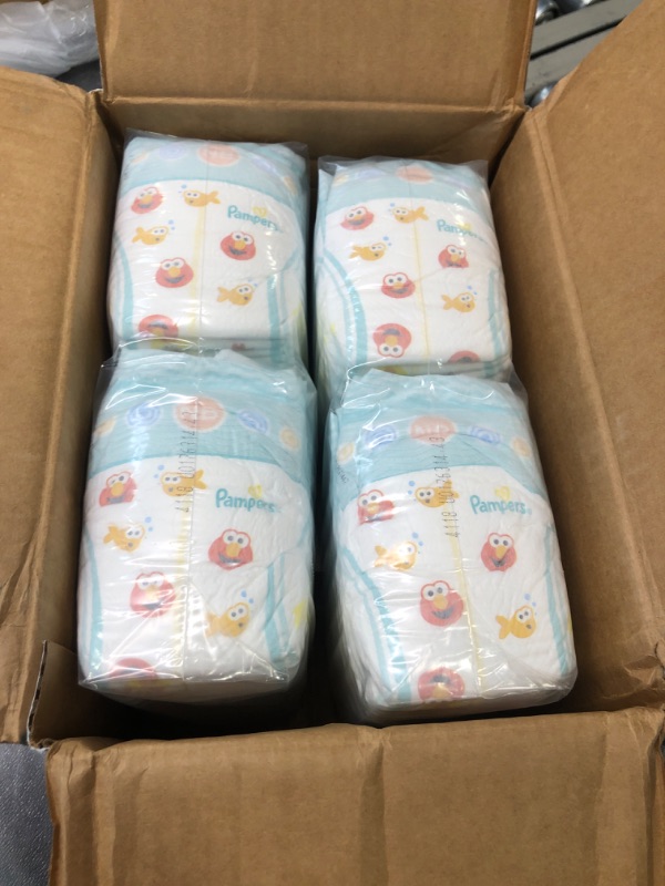 Photo 2 of Diapers Size Newborn/Size 0 (< 10 lb), 104 Count - Pampers Baby Dry Disposable Baby Diapers, Super Pack with Diapers Newborn/Size 1 (8-14 lb), 252 Count 