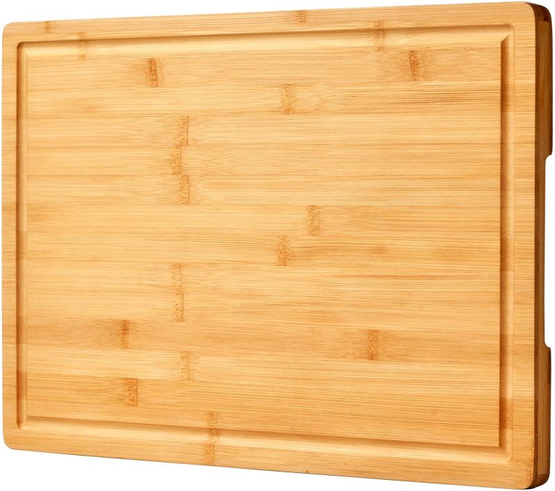 Photo 1 of Bamboo Cutting Board for Kitchen, 18" Large Wood Charcuterie Cheese Board, Wooden Chopping Block with Side Handles and Juice Grooves
