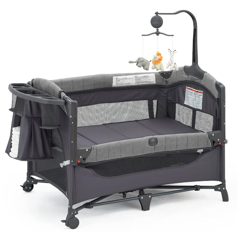 Photo 1 of Baby Bassinet Bedside Bassinet Sleeper, 5-in-1 Pack and Play with Full-Size Bassinet,Baby Playard with Changing Table,Storage Shelf,Music Mobile with Soft Toys for Newborn to Toddlers (grey)

