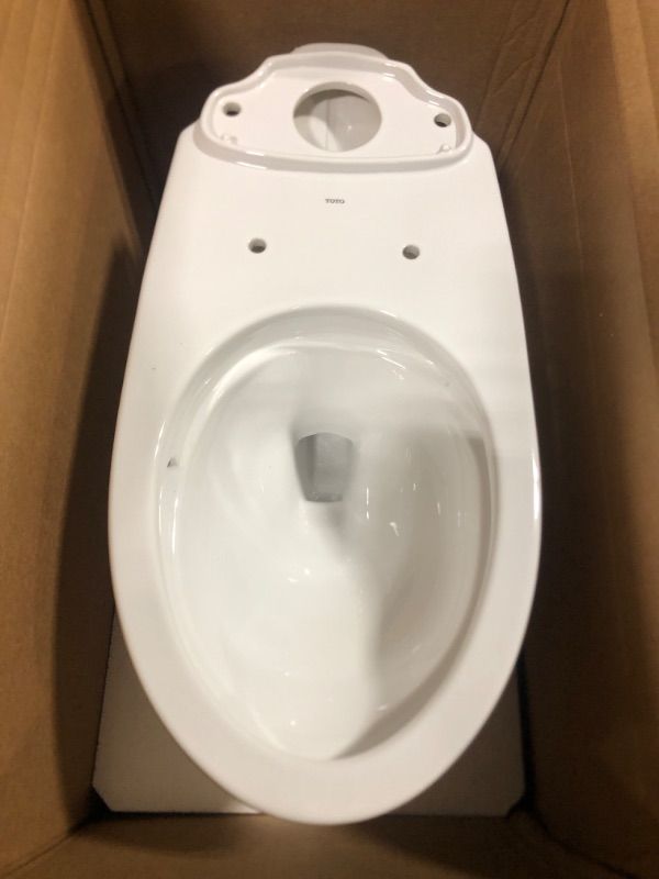 Photo 1 of ***only 1 pc****TOTO Drake Two-Piece Elongated 1.6 GPF TORNADO FLUSH Toilet with CEFIONTECT, Cotton White - CST776CSG#01