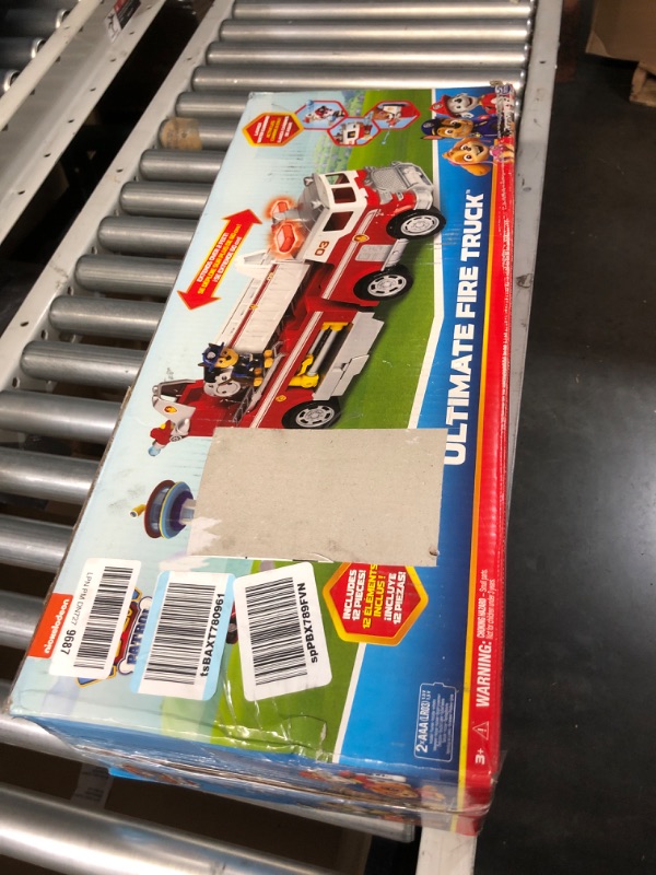 View 2 of PAW Patrol Ultimate Rescue Fire Truck with 2 Ft. Ladder, Lights, Sounds, a Mini Toy Car, Chase, Marshall & Skye Figures, Toys for Boys & Girls Ages 3+