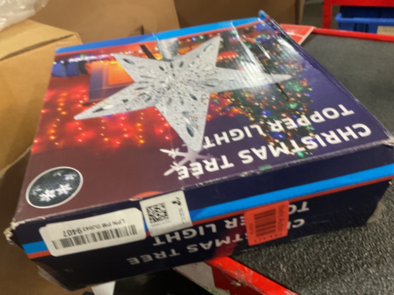 Photo 1 of DG-Direct Christmas Tree Topper Lighted Star [Silver],3D Hollow Sparkling Star Christmas Tree Topper with Rotating Magic Cool White Snowflake Projector for Christmas Tree Ornament (Silver)