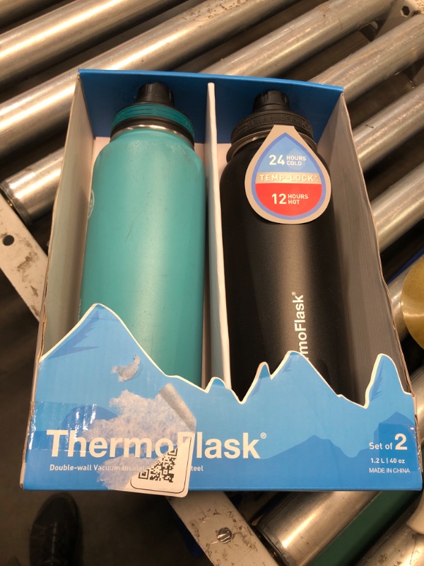 Photo 3 of ***(MINOR DAMAGE/ SEE NOTES) ***
ThermoFlask Bottle with Spout Lid - Stainless Steel Water Bottles with Double-Wall Insulation & BPA-Free Spout Lids - Leak-Proof Reusable Bottles & Lids - 40 oz, Onyx Black/Splash (2 Pack)