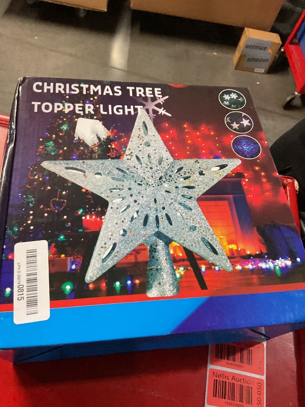 Photo 1 of OurWarm Christmas Tree Topper Lighted Star Tree Toppers with LED Rotating Snowflake Projector Lights, 3D Hollow Silver Star Snow Tree Topper for Christmas Tree Decorations