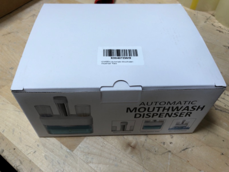 Photo 1 of Mouthwash dispenser - 