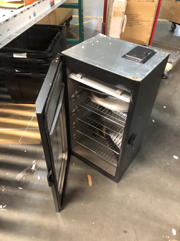 Photo 5 of ***USED - DIRTY - MISSING LEGS - OTHER PARTS LIKELY MISSING AS WELL - UNABLE TO TEST - SEE PICTURES***
Masterbuilt® 30-inch Digital Electric Vertical BBQ Smoker with Leg Kit, Side Wood Chip Loader and 710 Cooking Square Inches in Black, Model MB20070421