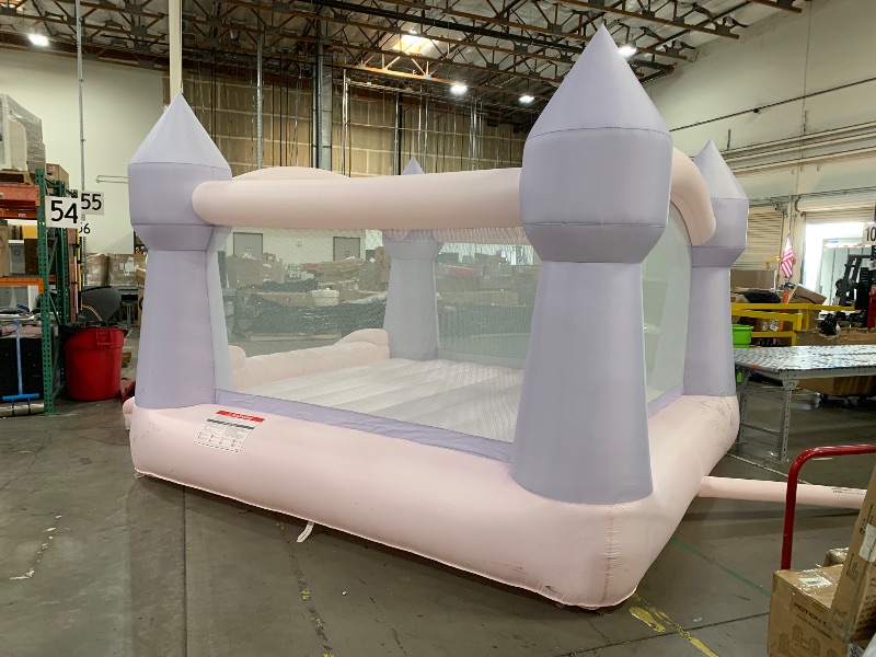 Photo 3 of   Bounceland Party Castle DayDreamer Cotton Candy Bounce House, 16.4 ft L x 13.1 ft W x 9.3 ft H, Basketball Hoop, UL Blower included, Trendy Pastel Color, Fun Slide & Bounce Area, Castle Theme for Kids
