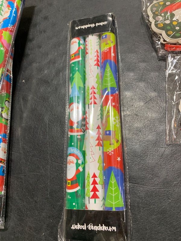 Photo 2 of Afucus Christmas Wrapping Paper, Mini Roll, Snowflake, Snowman, Christmas Tree, Santa Claus, Merry Christmas Gift Wrapping Paper Roll for Christmas, Party, Birthday, Holiday (17 Inch X 33 Feet)