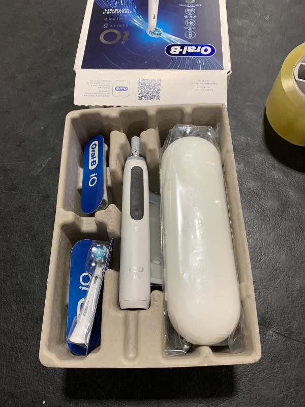 Photo 1 of Oral-B iO Deep Clean + Whiten Rechargeable Electric Toothbrush with Visible Pressure Sensor, 2 Minute Timer, 5 Cleaning Settings, 1 iO5 Limited, 3 Toothbrush Heads, Travel Case & Refill Holder, White
