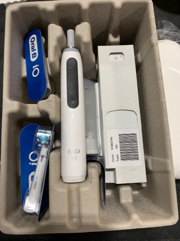 Photo 1 of Oral-B iO Deep Clean + Whiten Rechargeable Electric Toothbrush with Visible Pressure Sensor, 2 Minute Timer, 5 Cleaning Settings, 1 iO5 Limited, 3 Toothbrush Heads, Travel Case & Refill Holder, White